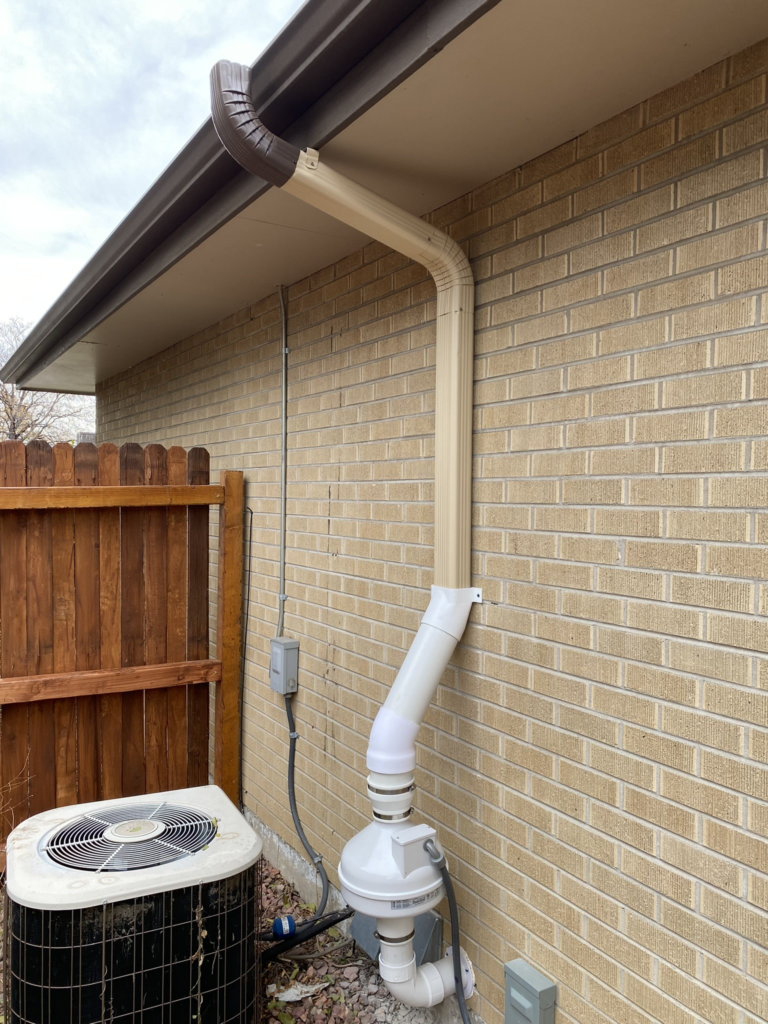 Radon mitigation system with offset elbow to avoid window obstruction