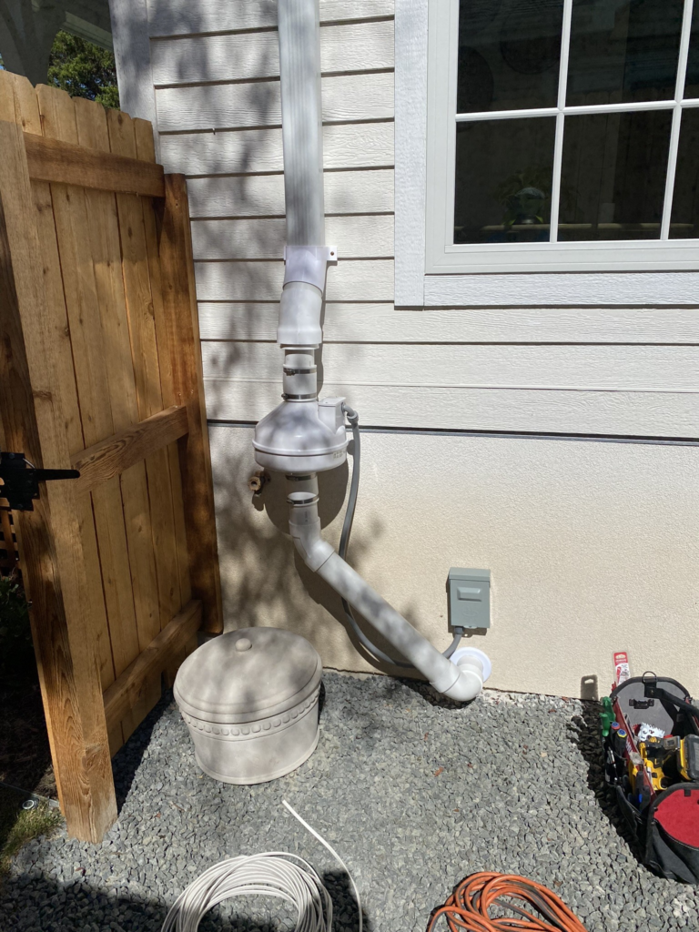 Radon mitigation fan with budget-friendly downspout transition